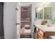 This bathroom features a single sink vanity and direct access to the backyard at 818 E Hiddenview Dr, Phoenix, AZ 85048
