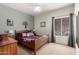 Comfortable bedroom featuring carpeted floors, wood furniture, and neutral colored walls at 818 E Hiddenview Dr, Phoenix, AZ 85048
