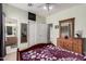 This bedroom includes sliding closet doors, neutral walls, carpeted floors, and an ensuite bathroom at 818 E Hiddenview Dr, Phoenix, AZ 85048