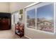 Bedroom featuring large windows, custom window coverings, and views of the backyard pool at 818 E Hiddenview Dr, Phoenix, AZ 85048