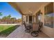 Charming covered patio providing a serene space for relaxation with a view of the backyard pool at 818 E Hiddenview Dr, Phoenix, AZ 85048