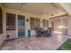 Inviting covered patio featuring a ceiling fan, ideal for outdoor dining and relaxation at 818 E Hiddenview Dr, Phoenix, AZ 85048