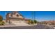 Attractive two-story home featuring a three car garage and mature desert landscaping at 818 E Hiddenview Dr, Phoenix, AZ 85048