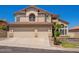 Charming two-story home featuring a three-car garage and well-maintained landscaping at 818 E Hiddenview Dr, Phoenix, AZ 85048
