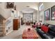 Spacious living room featuring neutral carpet, staircase, and an abundance of natural light at 818 E Hiddenview Dr, Phoenix, AZ 85048