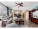 Well-lit living room featuring large windows, an open floor plan, and comfortable seating at 818 E Hiddenview Dr, Phoenix, AZ 85048
