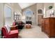 Bright living room with large windows, vaulted ceilings, and comfortable furnishings at 818 E Hiddenview Dr, Phoenix, AZ 85048