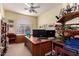 Bright, well-organized office space with ample storage and a large desk at 818 E Hiddenview Dr, Phoenix, AZ 85048