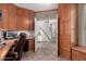 Functional home office with built-in cabinetry, open staircase and tiled flooring at 818 E Hiddenview Dr, Phoenix, AZ 85048