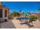 Inviting pool area with a covered patio and barbecue area, perfect for outdoor entertaining and relaxation at 818 E Hiddenview Dr, Phoenix, AZ 85048