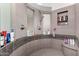 This modern shower features custom tile, built in shelving, a rain shower head, and a bench at 818 E Hiddenview Dr, Phoenix, AZ 85048