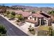 Charming homes line a street with mature trees and well-maintained lawns, showing neighborhood appeal at 818 E Hiddenview Dr, Phoenix, AZ 85048