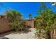 Private backyard featuring a concrete patio, mature landscaping and block wall that is perfect for entertaining at 8210 E Garfield St # K23, Scottsdale, AZ 85257