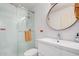 Modern bathroom featuring a glass enclosed shower, modern vanity, and stylish mirror at 8210 E Garfield St # K23, Scottsdale, AZ 85257