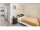Bedroom features a comfortable bed, wood floors, and natural light at 8210 E Garfield St # K23, Scottsdale, AZ 85257