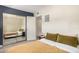 Bedroom with large closet, wood floors, and a calming color palette at 8210 E Garfield St # K23, Scottsdale, AZ 85257