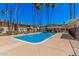 Inviting community pool with easy access, lounge chairs, and well-maintained grounds for residents' enjoyment at 8210 E Garfield St # K23, Scottsdale, AZ 85257