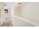 Hallway with wood floors and white walls. Access to bedrooms and built-in storage at 8210 E Garfield St # K23, Scottsdale, AZ 85257