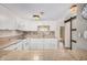 Well-lit kitchen offers white cabinetry, granite countertops, and stainless-steel appliances at 8210 E Garfield St # K23, Scottsdale, AZ 85257