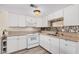 Bright kitchen features white cabinetry, granite countertops, and stainless-steel appliances at 8210 E Garfield St # K23, Scottsdale, AZ 85257