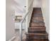 Staircase leading up to the next level, with a view into the bright kitchen at 8210 E Garfield St # K23, Scottsdale, AZ 85257