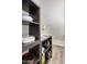 Corner storage area with gray shelving and multiple household items at 8210 E Garfield St # K23, Scottsdale, AZ 85257