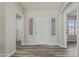 Inviting foyer with natural light, neutral paint, and durable floors leading into the home at 8620 W Denton Ln, Glendale, AZ 85305