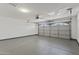 Spacious two car garage with ample parking and an automatic garage door opener at 8620 W Denton Ln, Glendale, AZ 85305