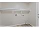 Bright laundry room with a shelf above hook ups at 8620 W Denton Ln, Glendale, AZ 85305