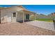 Nice backyard with covered patio, sliding glass doors and gravel landscaping at 8835 W John Cabot Rd, Peoria, AZ 85382