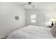 Cozy bedroom with a plush duvet, ceiling fan, and mount for a TV at 8835 W John Cabot Rd, Peoria, AZ 85382