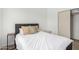 Comfortable bedroom features natural light, a soft color palette, and closet space at 8835 W John Cabot Rd, Peoria, AZ 85382