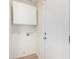 Bright laundry area featuring a utility sink connection box and sleek, modern cabinet at 8835 W John Cabot Rd, Peoria, AZ 85382
