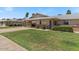 Lovely single-story home with a covered carport, green lawn, and well-kept landscaping at 10895 W Clair Dr, Sun City, AZ 85351
