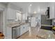 Updated kitchen features granite countertops, stainless appliances, and ample cabinet space at 10895 W Clair Dr, Sun City, AZ 85351