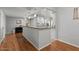 Spacious kitchen featuring granite countertops, stainless appliances, and a breakfast bar at 10895 W Clair Dr, Sun City, AZ 85351