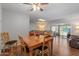 Comfortable dining and living area with hardwood floors and ample natural light at 10895 W Clair Dr, Sun City, AZ 85351