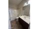 Bright bathroom features a shower-tub combo and a vanity with ample counter space at 11249 N 161St Ave, Surprise, AZ 85379