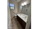 Bright bathroom with dual sinks, updated fixtures, and a separate shower at 11249 N 161St Ave, Surprise, AZ 85379