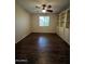 Charming bedroom with hardwood floors, built-in shelving, and natural light at 11249 N 161St Ave, Surprise, AZ 85379