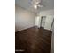 Inviting bedroom featuring hardwood floors, closet, and ceiling fan at 11249 N 161St Ave, Surprise, AZ 85379