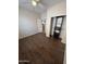 Spacious bedroom with wood-look floors, closet, and a view into the hallway at 11249 N 161St Ave, Surprise, AZ 85379