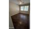 Cozy bedroom with hardwood floors, a ceiling fan, and bright windows at 11249 N 161St Ave, Surprise, AZ 85379