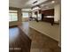 An eat-in kitchen with dark cabinets, granite countertops, and stainless steel appliances at 11249 N 161St Ave, Surprise, AZ 85379