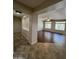Spacious living room with tile and wood-look floors, large windows and a ceiling fan at 11249 N 161St Ave, Surprise, AZ 85379