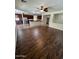Open-concept living room and kitchen area with wood floors and modern finishes at 11249 N 161St Ave, Surprise, AZ 85379