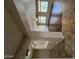 Bright, open-concept living room featuring wood-look floors and large windows for ample natural light at 11249 N 161St Ave, Surprise, AZ 85379