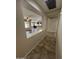 Living room and kitchen combo featuring hardwood floors, modern fixtures, and spacious layout at 11249 N 161St Ave, Surprise, AZ 85379
