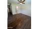 Spacious main bedroom with hardwood floors, a ceiling fan, and ample natural light at 11249 N 161St Ave, Surprise, AZ 85379