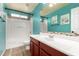 Bright bathroom with a shower-tub combo, updated vanity, and tiled accents at 11724 N 148Th Ave, Surprise, AZ 85379
